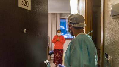 A doctor visits Covid-19 patients to check their state of health and evaluate their release from the hotel at the Living Place Hotel on November 18, 2020 in Bologna, Italy. Getty Images