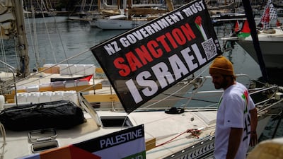 A banner with a message calling for the New Zealand government to sanction Israel hangs on a boat of a humanitarian flotilla preparing to depart for Gaza, in Barcelona. Reuters