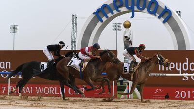 Patrick Dobbs riding Second Summer, right, wins the Godolphin Mile. Martin Dokoupil / Getty Images