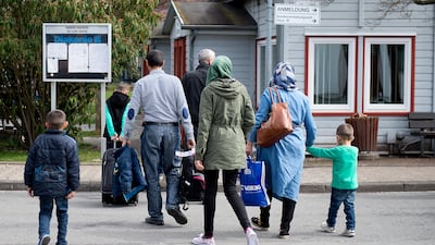 Refugees from Syria arrive at the Friedland shelter near Goettingen, central Germany. Swen Pfoertner / AFP