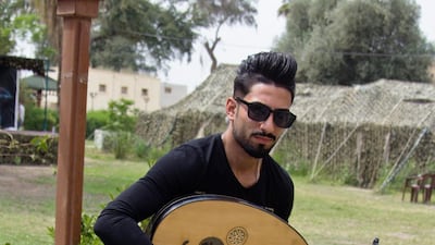 A lute player in Qushla park. Charlotte Mayhew/ The National