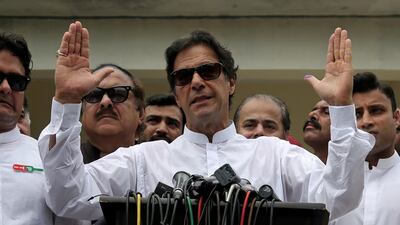 Imran Khan speaking to the media after casting his vote at a polling station during the general election in Islamabad, Pakistan in July. Athit Perawongmetha / Reuters