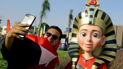 A supporter poses with the official Mascot Tut before the opening match of the 2019 Africa Cup of Nations between Egypt and Zimbabwe at Cairo International Stadium in Cairo, Egypt. EPA