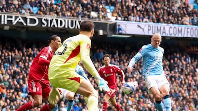 Erling Haaland scores his team's fourth goal, and his hat-trick, against Liverpool at the Etihad Stadium. Getty Images