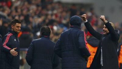 Bayern Munich’s coach Pep Guardiola celebrates with players after the match. REUTERS/Michaela Rehle