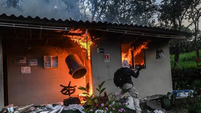 Demonstrators burn a toll station during an anti-government protest in Medellin, Colombia. Clashes between police and protesters have resulted in at least 42 deaths – including one police officer – and injured more than 1,500. AFP