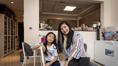 Sylvana Sari with her daughter Louisa, at their home in Al Rimmal Residence, Al Jaddaf. Antonie Robertson / The National