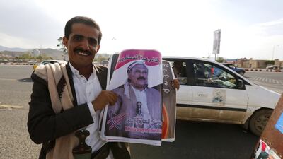 A Yemeni man holds posters depicting former president Ali Abdullah Saleh ahead of an anniversary celebration of Saleh’s party, General People's Congress, in Sana’a, Yemen, 20 August 2017. EPA/YAHYA ARHAB