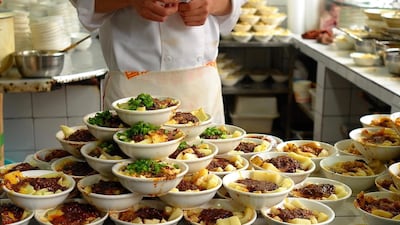 Chef with noodles ready for customers at Dongzi Wei Zhang Lao Er Liangfen, a popular restaurant next to the Wenshu monastery in Cheng Du.Courtesy James Langton