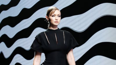 Gigi Hadid presents a creation by Versace during Milan Fashion Week, on February 21, 2020. EPA