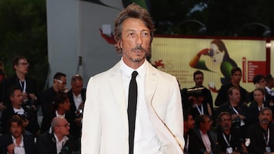 HIT: Valentino designer Pierpaolo Piccioli looked immaculate in a white suit.