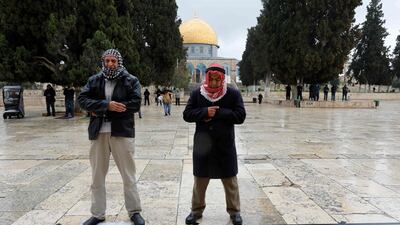 Palestinians perform Friday prayers at Al Aqsa mosque compound in the Old City of Jerusalem on March 20, 2020 after mosques were shut in a bid to stem the spread of the novel coronavirus. AFP