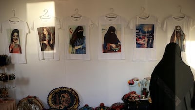 Printed T-shirts from Saudi Arabia on sale at one of the stalls at the Sheikh Zayed Heritage Festival. Ravindranath K / The National