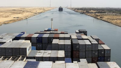 A cargo ship travels south along the Suez Canal towards Suez, Egypt. Kristian Helgesen / Bloomberg