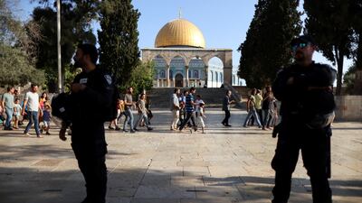 Israeli police keep watch while Jews visit the Al Aqsa compound in Jerusalem on Sunday. Reuters