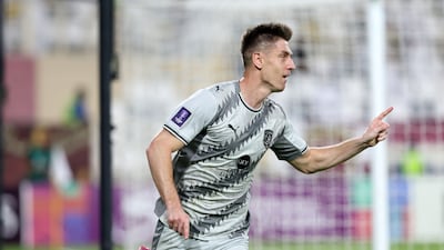 Krzysztof Piątek of Al Duhail scores a consolation goal.