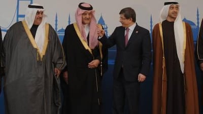 From left, Bahrain's Foreign Minister, Sheik Khalid bin AhmedI bin Mohammed Al Khalifa, Saudi Arabia's Foreign Minister Prince Saud Al-Faisal, his Turkish counterpart Ahmet Davutoglu and United Arab Emirates' Sheikh Abdullah bin Zayed Al Nahayan seen during a group photo during the Gulf Cooperation Council foreign ministers meeting in Istanbul, Turkey on Saturday.
