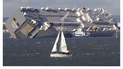 The giant car transporter ship Hoegh Osaka, which is still beached on Branble Bank in the Solent. Express Newspapers via AP Images