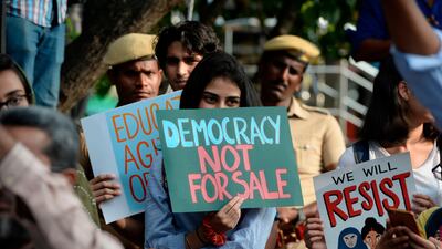Students and demonstrators hold placards during a protest against India's new citizenship law in Chennai on December 19, 2019. Indians defied bans on assembly on December 19 in cities nationwide as anger swells against a citizenship law seen as discriminatory against Muslims, following days of protests, clashes and riots that have left six dead. AFP