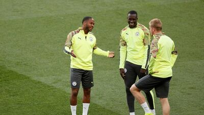 Left to right: Manchester City's Raheem Sterling, Benjamin Mendy and Kevin De Bruyne. Reuters