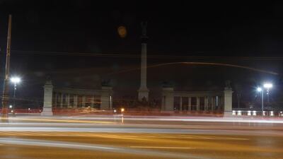 The Millennium Monument, a landmark of the Hungarian capital with its illumination switched off during the Earth Hour event, in Budapest, Hungary. Tamas Kovacs / MTI via AP