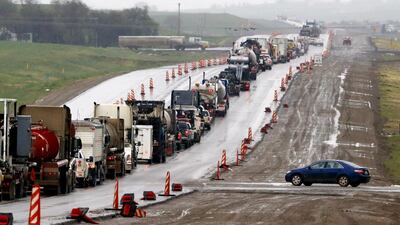A traffic accident adds to the expansion problems of US Route 85 between Williston and Watford City, North Dakota. Charles Rex Arbogast / AP Photo