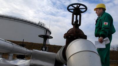 A Hungarian Oil and Gas Company engineer checks the receiving area of the Druzhba oil pipeline in Szazhalombata refinery, south of Budapest. AP