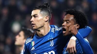 Cristiano Ronaldo celebrates with Colombian midfielder Juan Cuadrado after opening the scoring. AFP