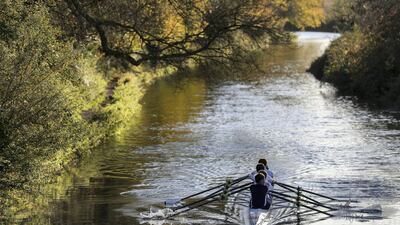 Rowers from the Winchester College Rowing club make their way along the Itchen Navigation in Winchester. Reuters