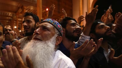 Muslims raise their hands as they pray during special night prayers on the 27th night of the holy fasting month of Ramadan known as " Laylat al-Qadr at Jamia Masjid or Grand Mosque in Srinagar, the summer capital of Indian Kashmir, early 12 June 2018. Farooq Khan / EPA
