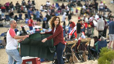 Abu Dhabi, United Arab Emirates - Family set up their spots before the carol singing in the desert. Khushnum Bhandari for The National