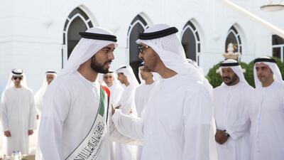 Sheikh Mohammed bin Zayed, Crown Prince of Abu Dhabi and Deputy Supreme Commander of the Armed Forces, greets an Islamic student while receiving a delegation of participants of the Forum for Promoting Peace in Muslim Societies, during a Sea Palace barza. Ryan Carter / Crown Prince Court — Abu Dhabi
