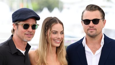 Brad Pitt, Margot Robbie and Leonardo DiCaprio debated the divisive question of whether Jack and Rose could have fitted on the same floating door in 'Titantic' at a recent press event. Getty Images