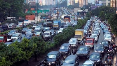 Drivers battle rush hour traffic in Indonesia's capital, Jakarta, which has some of the world's worst vehicle congestion.