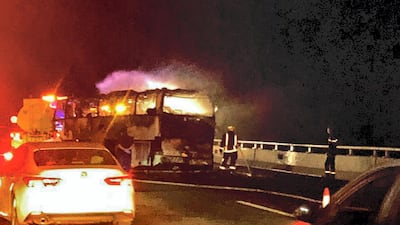 The pilgrims' bus in flames on the road near the town of Medina. AFP