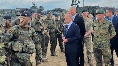 German Chancellor Olaf Scholz and Lithuanian President Gitanas Nauseda visit German troops of the Nato-enhanced Forward Presence Battlegroup in Lithuania on June 7. Reuters
