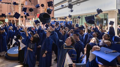 Students of the Mohamed bin Zayed University of Artificial Intelligence celebrate their graduation. Antonie Robertson / The National