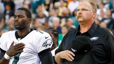 Andy Reid, right, the Philadelphia Eagles' head coach, says that Michael Vick, left, and the rest of his side are more of a team entering this season than last.