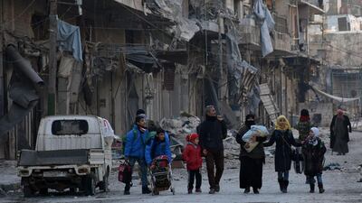 People carrying their belonging and leaving the eastern neighbourhoods of Aleppo, Syria on December 7, 2016. According to the Syrian Arab News Agency (Sana), the army secured the exit of new batches of civilians who were besieged by ‘terrorists’ in east of Aleppo after recapturing several neighbourhoods. Sana Handout/EPA