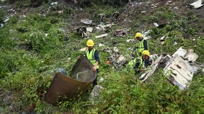 Rescuers at the crash site near Tribhuvan International Airport in Nepal's capital Kathmandu. AP