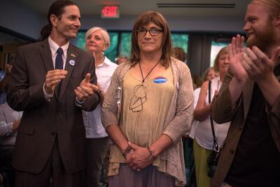 Christine Hallquist, centre, at a Vermont Democratic 'unity rally' on August 15, 2018 in Burlington, Vermont. She is the first transgender candidate to win a major party nomination for governor. Hillary Swift / Getty Images / AFP