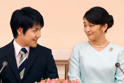Princess Mako, right, and her fiancee Kei Komuro. Shizuo Kambayashi / AFP