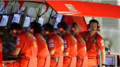 The Ferrari chief engineers sit on the pitwall while Felipe Massa's race engineer, Rob Smedley, looks on.