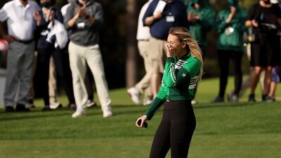 Paulina Gretzky, fiancée of Dustin Johnson, reacts on the 18th green. AFP