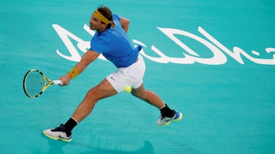 Rafael Nadal returns a ball to Kevin Anderson during their Mubadala World Tennis Championship semi-final in Abu Dhabi. EPA