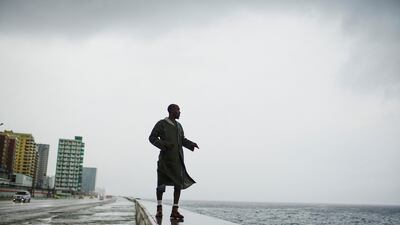 Alexander Charnicharo fishes at the seafront in Havana as Hurricane Michael passes by western Cuba. Reuters