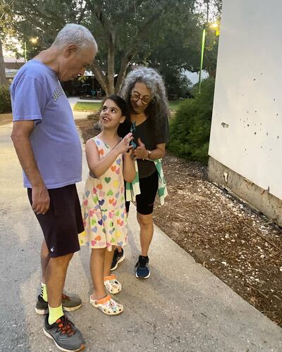 Gadi Haggai and Judi Weinstein pictured with their granddaughter. Photo: Iris Weinstein Haggai