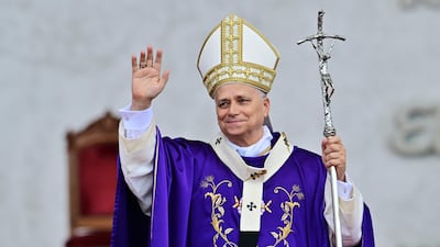 The Pope waves at the end of the mass. AFP
