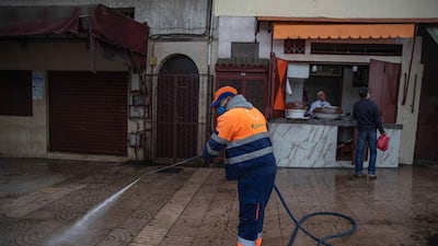 A worker disinfects a street to prevent the spread of the coronavirus during a state of emergency in Rabat, Morocco. AP