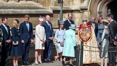 Members of the royal family greet Queen Elizabeth II as she arrives for the Easter Sunday service at St George's Chapel in Windsor, England. Getty Images